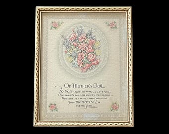 May include: A framed print with a floral bouquet of pink and white flowers with green leaves. The print has a lace-like border and the text "On Mother's Day To You - Dear Mother - I Love You And Always Will My Whole Life Through... You Are So Loving - Kind and Dear That Mother's Day Is All The Year..."