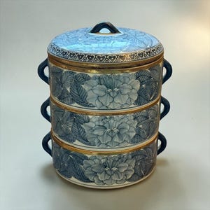 TIFFIN BOX…Three-Tier…Blue & White…Floral Pattern…Gold Rims…Small, Dark Blue Top and Side Handles…Stacking Dishes…Vintage #000Bx10/16