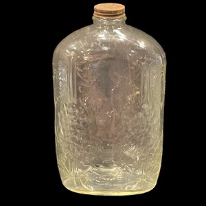 LARGE WINE BOTTLE…Embossed Leaf and Grape Design…Clear Bottle…”One Half Gallon” Metal Top…Vintage