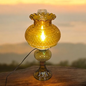 AMBER HOBNAIL LAMP…Tall Amber Glass Pedestal Base…Glass Center…3 Metal Shade Arms…Ruffled Shade…Clear Glass Hurricane…Turn Knob…Vintage