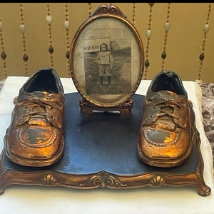BRONZED SHOE STAND With Baby Shoes and Frame…Metal Footed Stand…Oval Glass Frame…Decorative…Vintage Collectible....1960s #W.T.1U