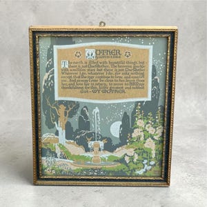 May include: A framed print with a gold-colored frame. The artwork features a landscape with a fountain, trees, and flowers, with text that reads "OTHER" and "Gift - MY MOTHER."