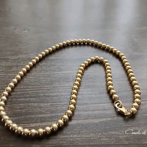 18-karat gold bead necklace over sterling silver. Stackable gold choker. Delicate necklace with small gold vermeil beads.
