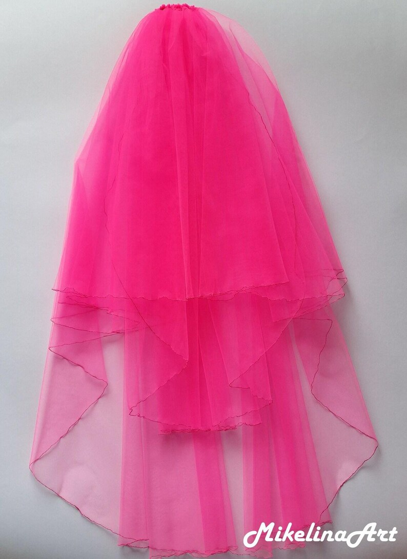 May include: A bright pink bridal veil with multiple layers of sheer fabric. The veil is gathered at the top and cascades down, featuring a scalloped edge. The text "MikelinaArt" is visible at the bottom right.