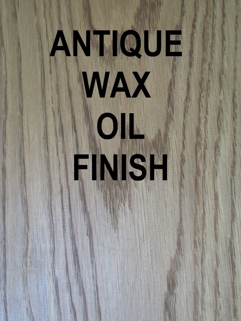 May include: Close-up of a wood surface with a light brown stain. The surface has a grainy texture. The text "Antique Wax Oil Finish" is printed in black on the wood.