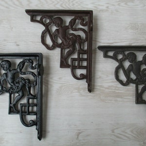 Pair of CHERUB Cast iron Rustic vintage retro scaffold shelf brackets Decorative ornate fancy victorian cistern toilet brackets