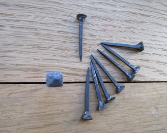 Small hand forged iron split nail for wood with ring for hitching hanging objects vintage architectural salvage for restorations