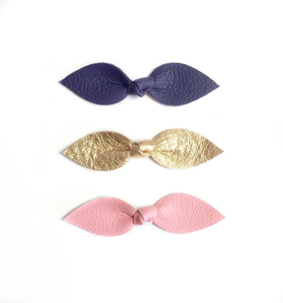 Leather Knot hair bows for baby girl or toddler in pink, gold and purple. Handmade by fourjaysbows