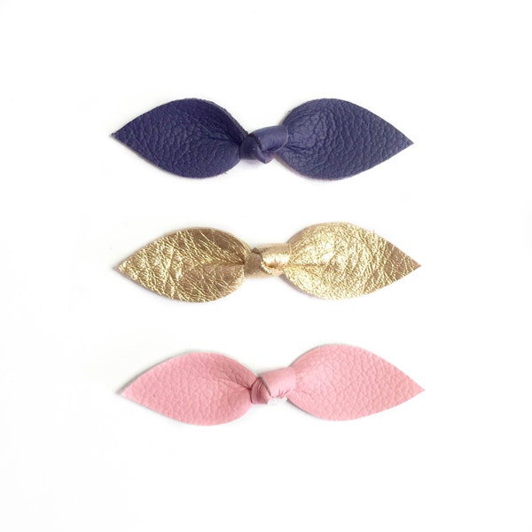 Leather Knot hair bows for baby girl or toddler in pink, gold and purple. Handmade by fourjaysbows