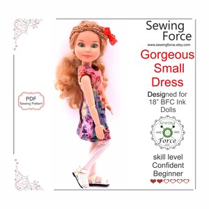 May include: A PDF sewing pattern for a small dress designed for 18-inch BFC Ink dolls. The pattern is called "Gorgeous Small Dress" and is labeled as a "Confident Beginner" skill level. The image shows a doll wearing the dress.