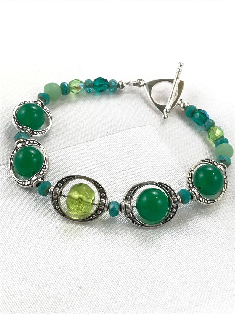 Shades Of Green Floating Beaded Bracelet Silver Bead Frames Image 0