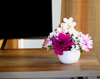 Low and Purple Flower Arrangement in Vase.
