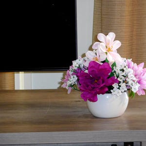 Low and Purple Flower Arrangement in Vase.