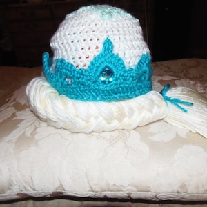 These are Disney Princess Elsa inspired, handmade crochet hats with a jewel embellished crown. These are made to order and the sizes vary.