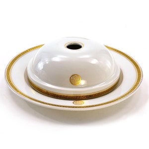 May include: White ceramic serving dish with a gold trim and a matching dome lid. The lid has a gold monogram "SR" in the center.