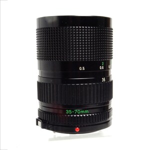 May include: A black Canon 35-70mm zoom lens with a silver ring and a red dot on the bottom.