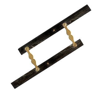 May include: A wooden drafting tool with two parallel rulers connected by two brass hinges. The rulers are black and the hinges are gold.