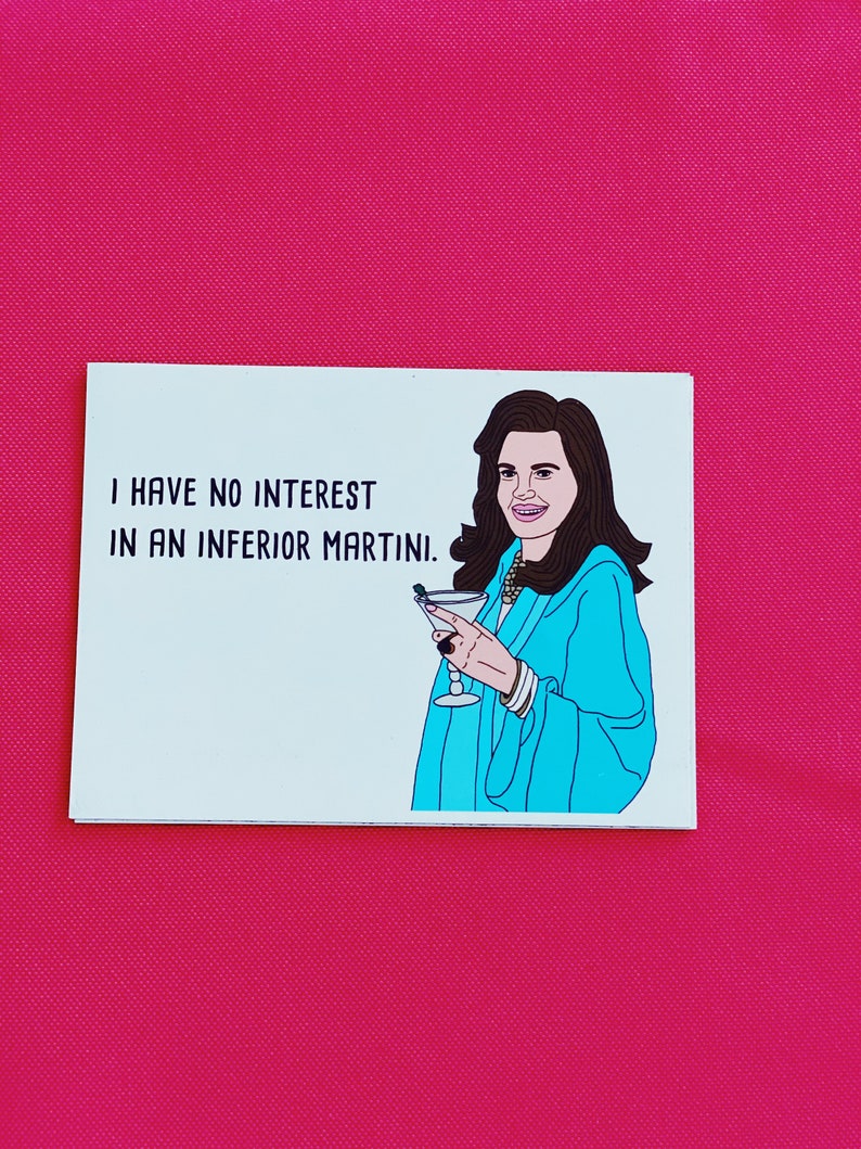 May include: A white card with black text that reads "I have no interest in an inferior martini." A cartoon illustration of a woman with long brown hair holding a martini glass is on the right side of the card.