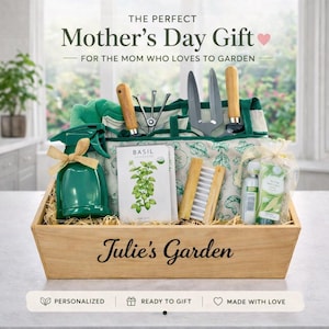 May include: A wooden gift basket filled with gardening tools, a green spray bottle, basil seeds, and other gardening accessories. The text "Julie's Garden" is on the front of the basket. The text "Mother's Day Gift" is at the top.