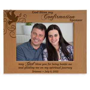 May include: A wooden photo frame with a dove and floral design. The frame has the text "God bless my Confirmation Sponsor" and "may God bless you for being beside me and guiding me on my spiritual journey Brianna - July 6, 2022".