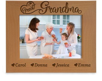 May include: A light brown wooden picture frame with the words "Great Grandma" carved at the top. The frame holds a photo of four women and a child. The names "Carol", "Donna", "Jessica", and "Emma" are carved at the bottom.