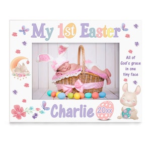 May include: White picture frame with the text "My 1st Easter" and "Charlie 20xx". The frame features a baby in a bunny outfit inside a basket, surrounded by Easter eggs and bunny illustrations.