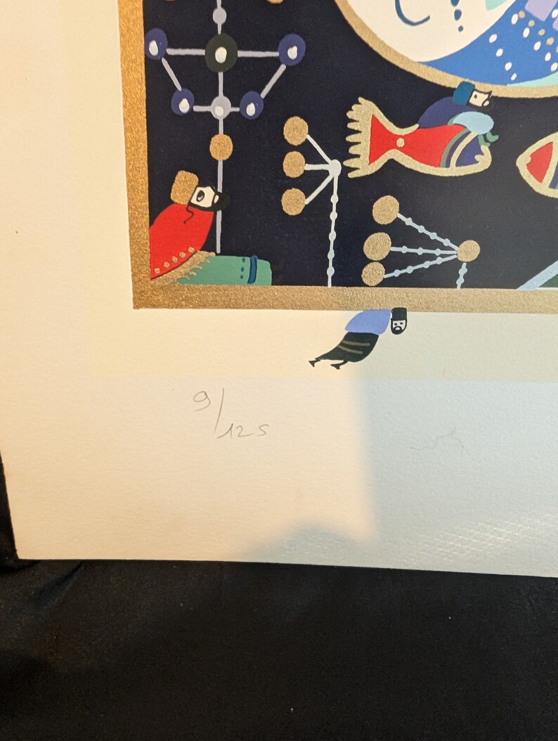 May include: A colorful print with a black background featuring a red bird, a blue and white geometric design, and a gold frame. The print is signed "9/125".