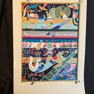 May include: A colorful, intricate illustration with a whimsical, fairytale-like theme. The artwork features a variety of figures, animals, and objects, including birds, fish, and a bed with a sleeping figure. The illustration is set against a background of blue, green, and gold.