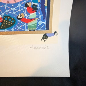 May include: A colorful print of a scene with multiple figures in a blue and gold frame. The print is signed "Abecossis" in the bottom right corner.