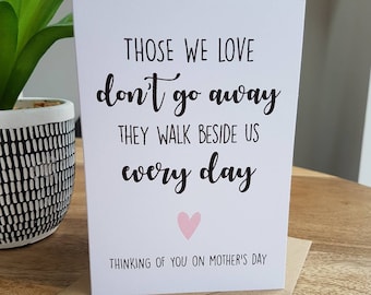 May include: A white card with black text that reads "Those we love don't go away they walk beside us every day."  A pink heart is below the text. The card also says "Thinking of you on Mother's Day."
