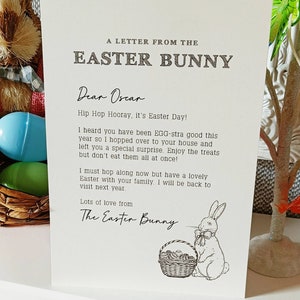 May include: A cream-colored card with the text "A Letter From The Easter Bunny." The letter is addressed to "Oscar" and includes a drawing of a bunny with a basket of eggs. The letter is a message from the Easter Bunny.