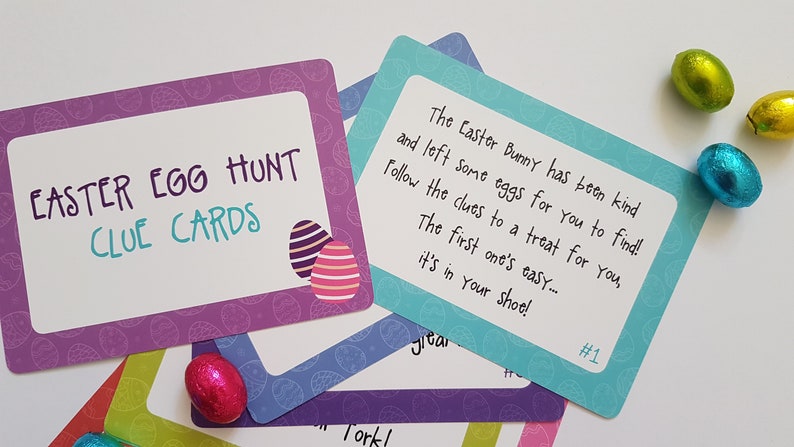 May include: Purple and blue Easter egg hunt clue cards with a colorful egg design. The first card reads "The Easter Bunny has been kind and left some eggs for you to find! Follow the clues to a treat for you, The first one's easy... it's in your shoe! #1"