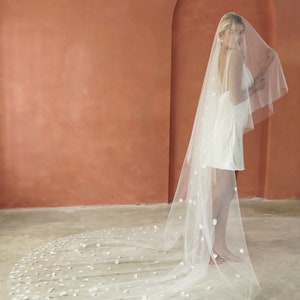 Image of model wearing Cathedral length drop veil wedding veil for modern brides.