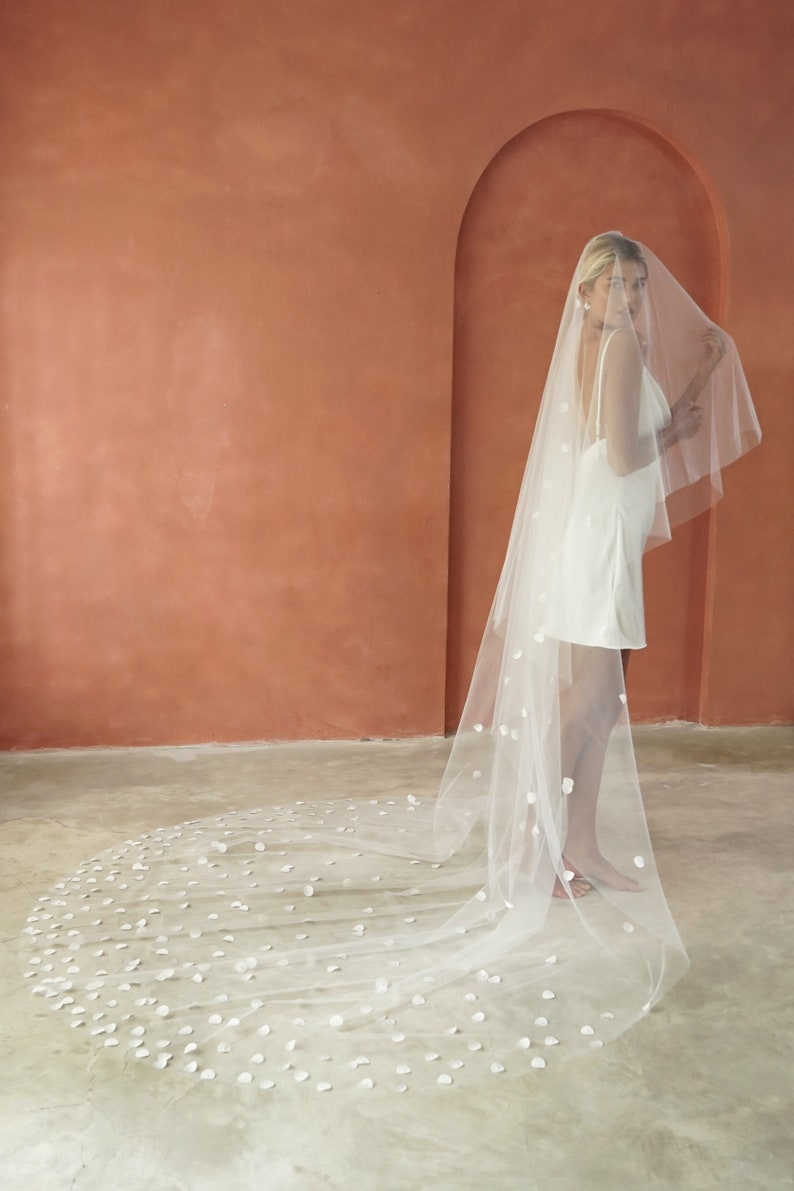 Image of model wearing Cathedral length drop veil wedding veil for modern brides.