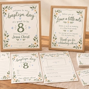 May include: Two framed signs and several printed cards for a baptism celebration. The signs feature floral borders, the number 8, and text including 'welcome to my baptism day' and 'leave a little note'. The cards include templates for memories.