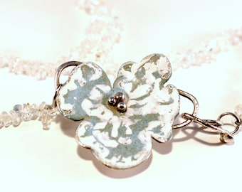 Enamelled silver pendant on aquamarine cord