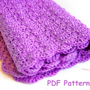 May include: Purple crochet baby blanket with a scalloped edge. PDF Pattern.