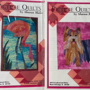 May include: Two colorful quilt patterns. One features a pink flamingo in a blue and green water scene. The other depicts a brown and tan dog with a red bow. The text "PICTURE QUILTS by Sharon Malec" is at the top.