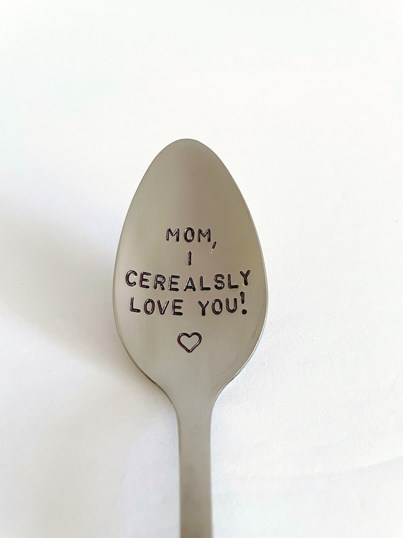 May include: A silver spoon with the words "MOM, I CEREALSLY LOVE YOU!" engraved on it. A small heart is engraved below the text.
