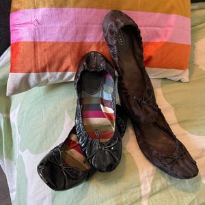 COACH Pop up!!! Two COACH Jilly Crinkle ballet flats-black patent and brown signature fabric. 7.5 women’s size.