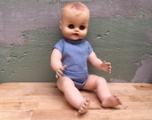 Vintage Collectible Hard Plastic Jointed Baby Doll With Sculpted Hair And Painted Face