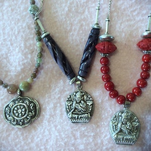 Tibetan Buddhist Amulet. Buddha, Dharma Wheel Pendant Necklace. Repousse Sterling Silver 20 or 22 in.  free US ship 49.00 ea