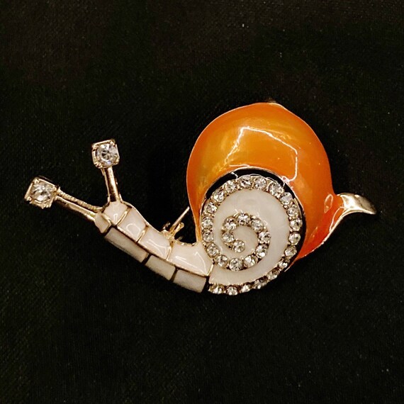 Snail brooch deals