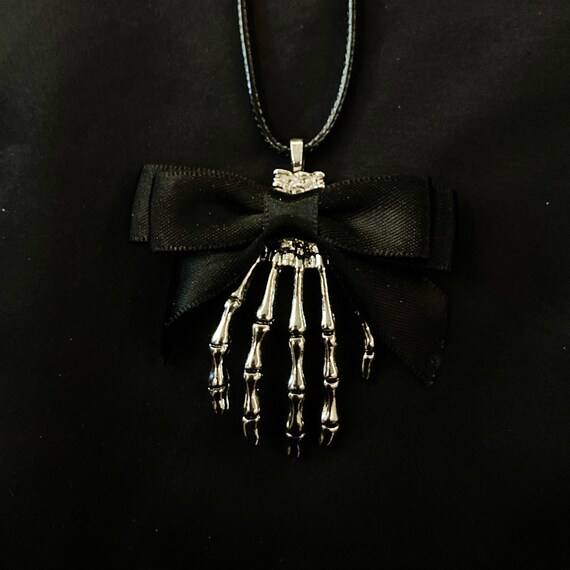 Skeleton hand necklace sale