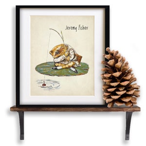 May include: A framed illustration of a frog wearing a hat and holding a fishing rod. The frog is sitting on a lily pad and the text "Jeremy Fisher" is printed above the frog.