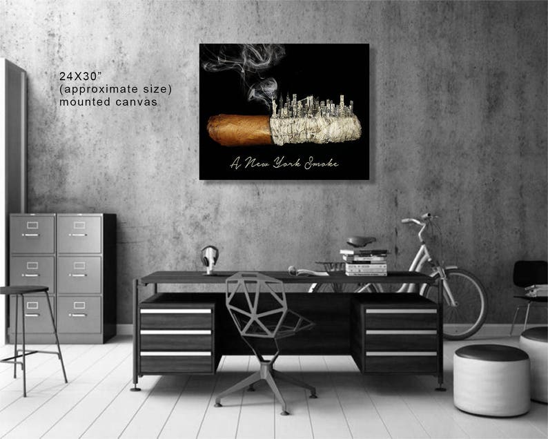 May include: A black and white canvas print of a cigar with a cityscape made of smoke rising from it. The text "A New York Smoke" is printed below the image. The canvas is 24 inches by 30 inches.