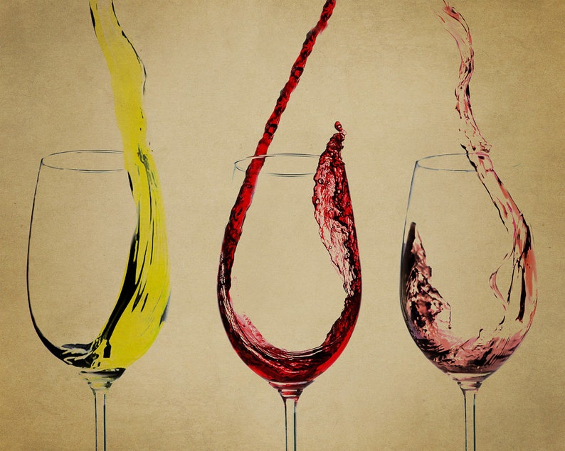 May include: Three wine glasses with red, white, and yellow wine pouring into them. The wine is splashing and creating a dynamic image.