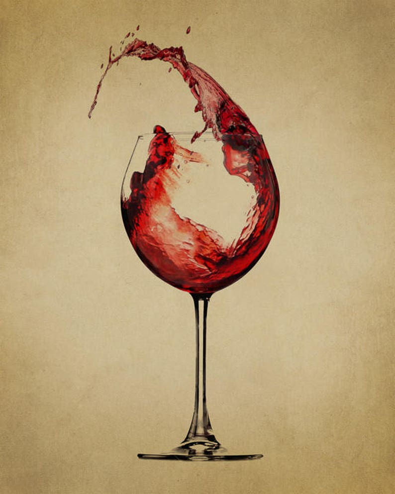 May include: A glass of red wine with a splash of wine coming out of the glass.
