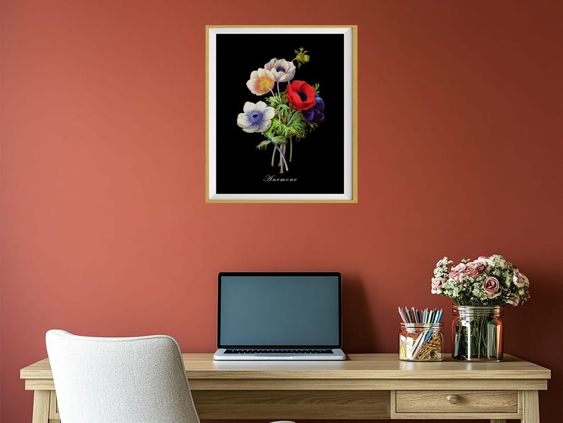 May include: A framed black and white botanical illustration of a bouquet of red, white, and blue anemones. The text "Anemone" is printed below the flowers.