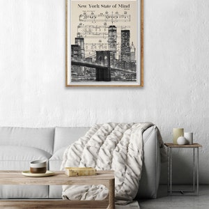 May include: Black and white photo of the New York City skyline at night with the Brooklyn Bridge in the foreground. The image is overlaid with sheet music for the song "New York State of Mind" by Billy Joel.
